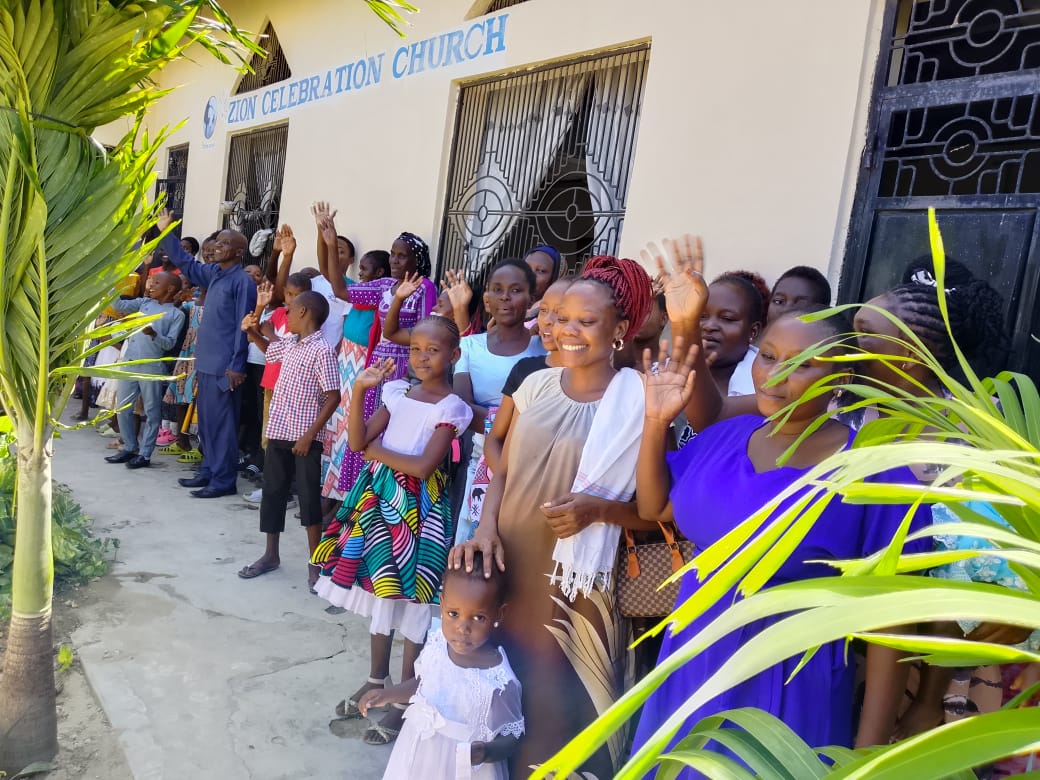 Zion Celebration Church group waving outside
